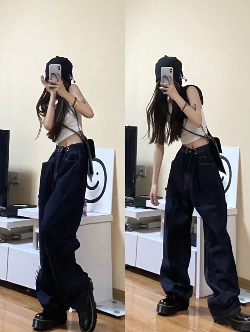 Cô gái trẻ tự tin với áo crop top trắng và quần jeans đen