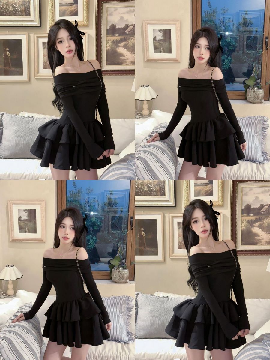 Cô gái xinh đẹp trong váy đen dài giữa phòng khách sáng tạo