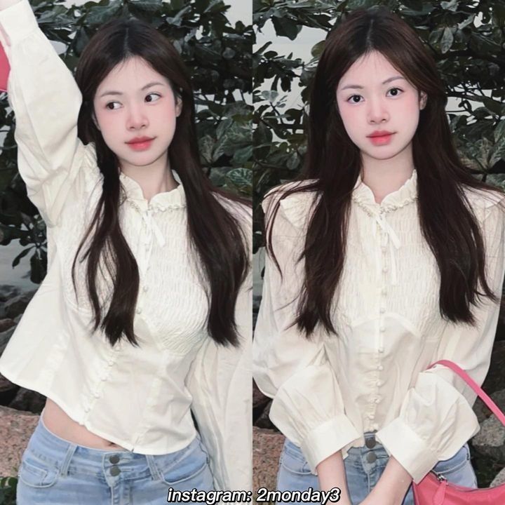 Cô gái xinh mặc áo sơ mi trắng, quần jeans trẻ trung