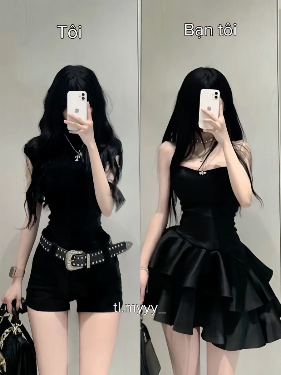 Hai cô gái trẻ mặc trang phục màu đen chụp ảnh selfie trong phố